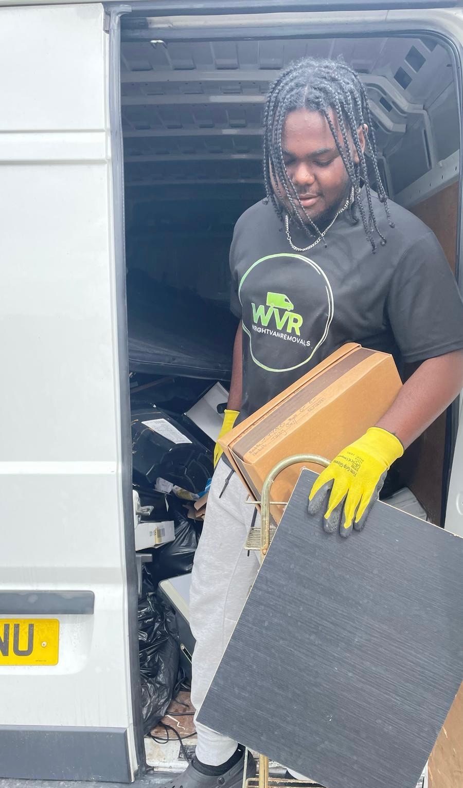 WrightVanRemovals crew loading junk and old furniture into a Luton van